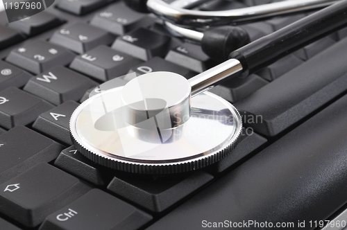 Image of stethoscope on computer keyboard