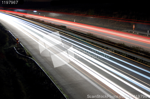 Image of highway at night with traffic