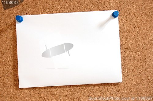 Image of blank sheet of paper on bulletin board