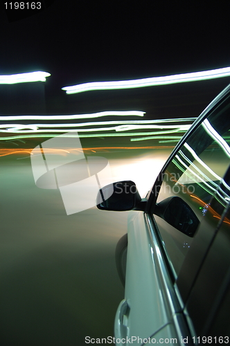 Image of night drive with car in motion 