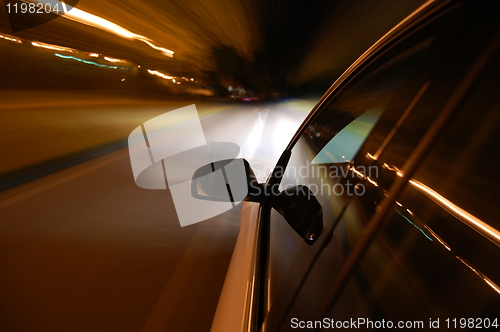 Image of night drive with car in motion 