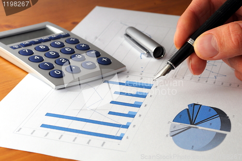 Image of business chart and hand