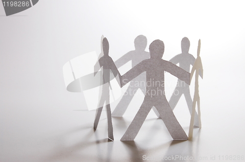 Image of teamwork of paper man