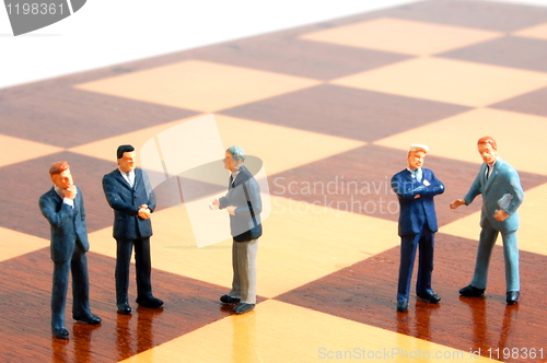 Image of business man on a chess board