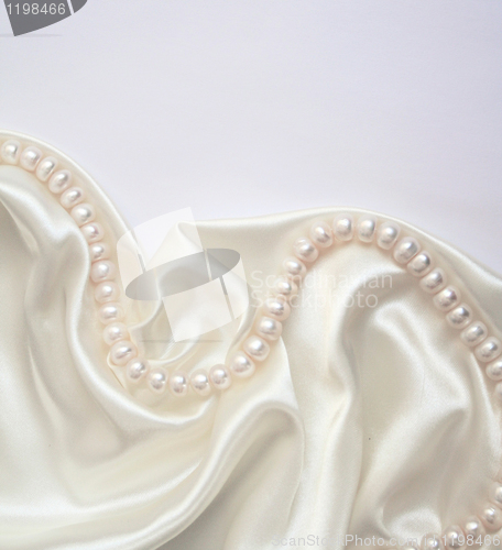 Image of Smooth elegant white silk with pearls as wedding background 