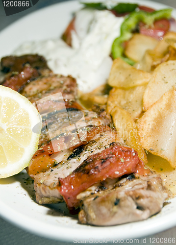 Image of pork souvlaki with tzatziki taverna food Greece