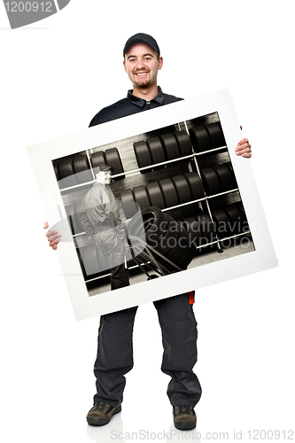 Image of smiling worker with board