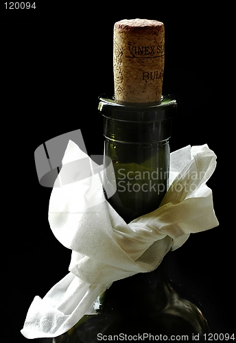 Image of bottle of wine with napkin