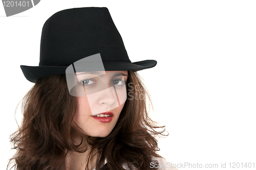 Image of portrait of a beautiful brunette in a hat