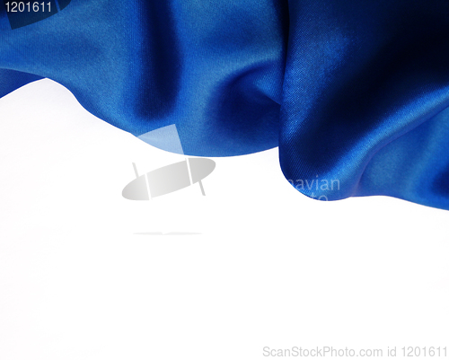 Image of Smooth elegant dark blue silk on white background 