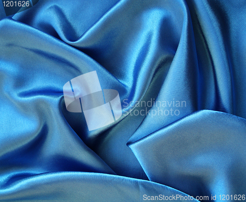 Image of Smooth elegant blue silk as background 