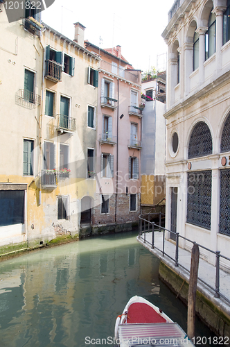 Image of canal scene with boat Venice Italy