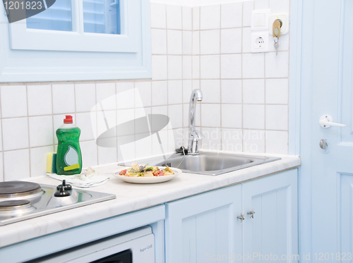 Image of interior Greek island motel apartment kitchen