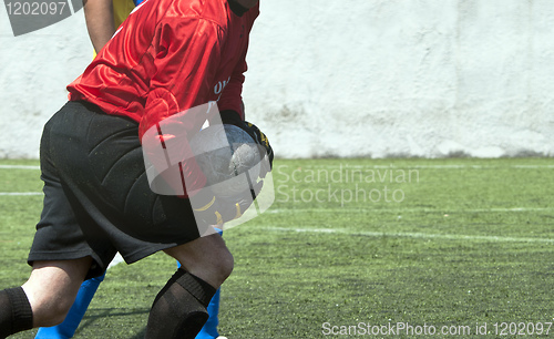 Image of Red dressed football goalkeeper