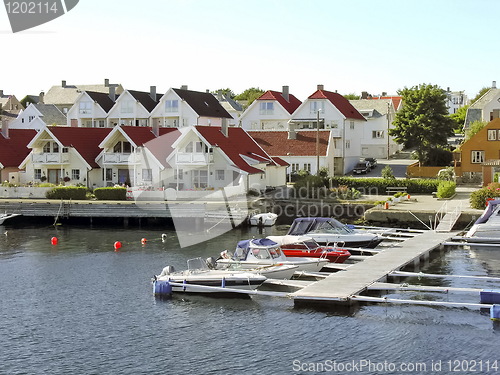 Image of Little houses on a river