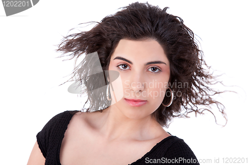 Image of beautiful woman with hair on wind