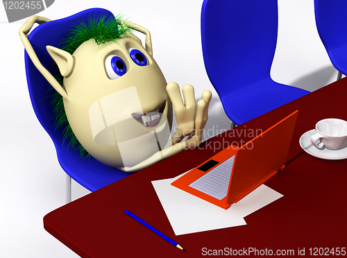 Image of Puppet resting behind orange laptop on chair