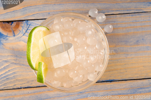 Image of tapioca pearls with lime. white bubble tea ingredients