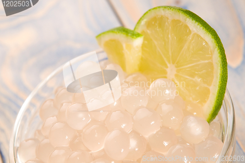 Image of tapioca pearls with lime. white bubble tea ingredients