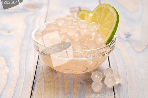 Image of tapioca pearls with lime. white bubble tea ingredients