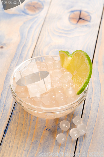 Image of tapioca pearls with lime. white bubble tea ingredients