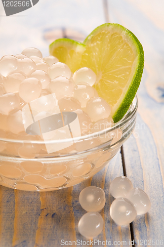 Image of tapioca pearls with lime. white bubble tea ingredients