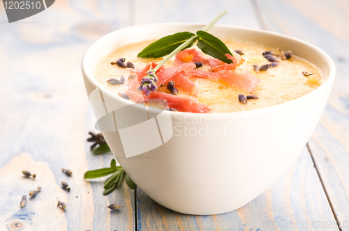 Image of fresh melon soup with parma ham and lavender flower