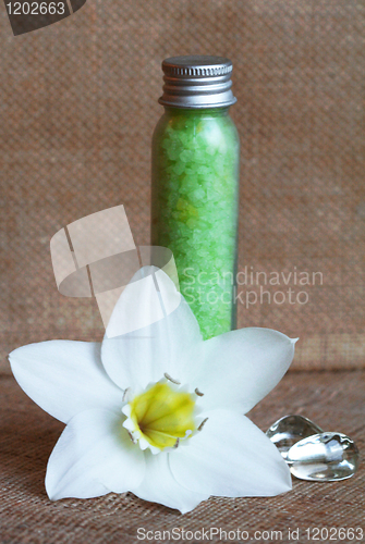 Image of Bottles of sea salt and white flower