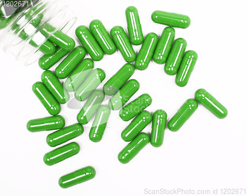 Image of Green pills on white background