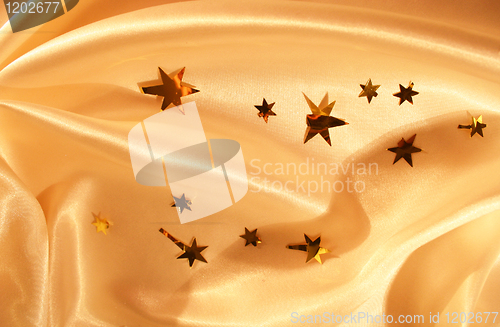Image of New year holiday golden silk as background 
