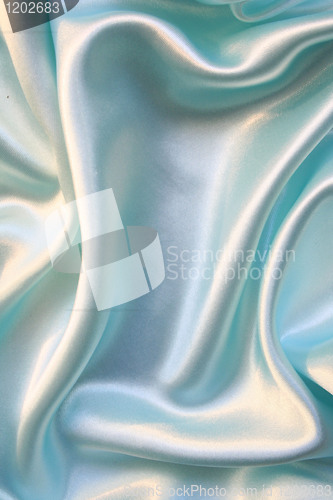 Image of Smooth elegant blue silk as background