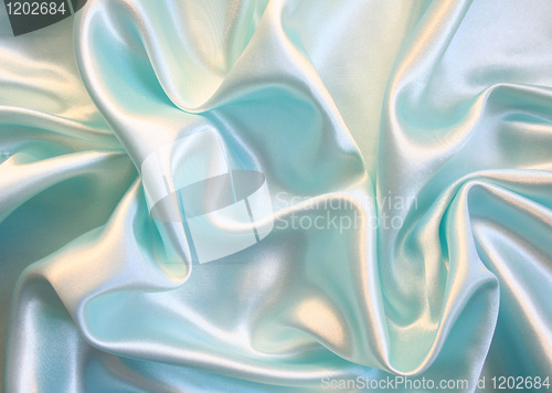 Image of Smooth elegant blue silk as background