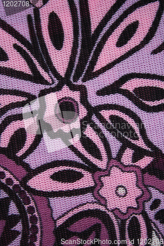 Image of Pattern with lilac flowers on a fabric as background 