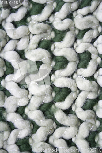 Image of Green and white knitted wool background