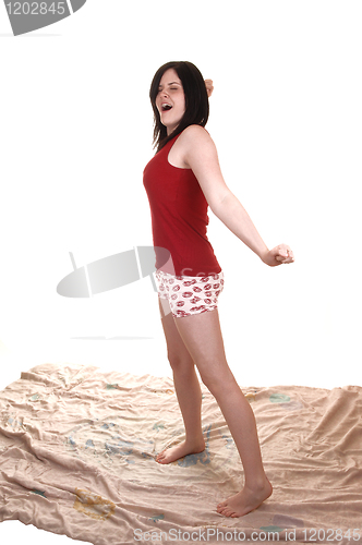 Image of Girl standing stretching.
