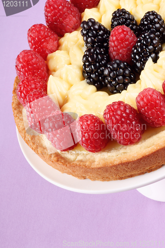 Image of Custard tart with raspberries and blackberries