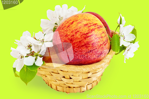 Image of Red apples in a basket with flowers