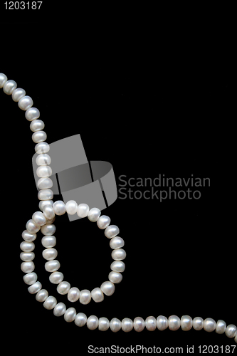 Image of White pearls on the black silk