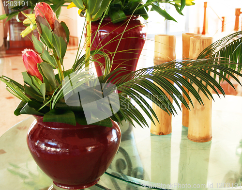 Image of Beautiful decor with two vases with flowers and bamboo 