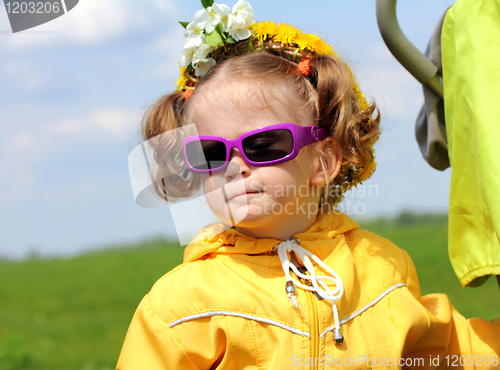 Image of cute funny little girl in sunglasses