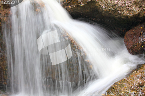 Image of waterfall among rocks close-up