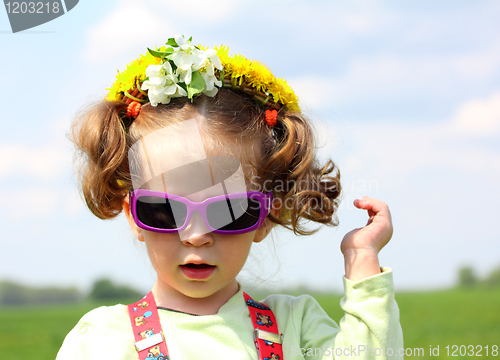 Image of cute funny little girl in sunglasses