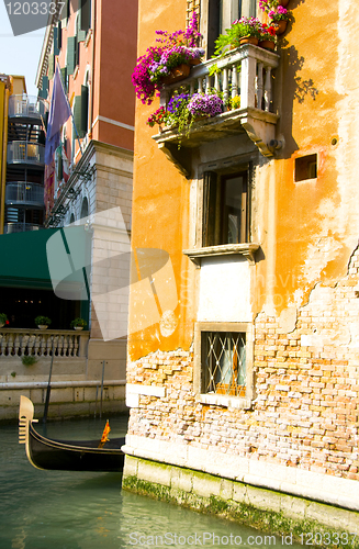 Image of canal scene with gondola boat Venice Italy