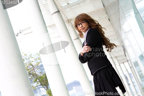 Image of pretty asian business woman at office building 