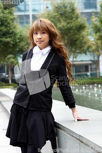 Image of pretty asian business woman at office building 