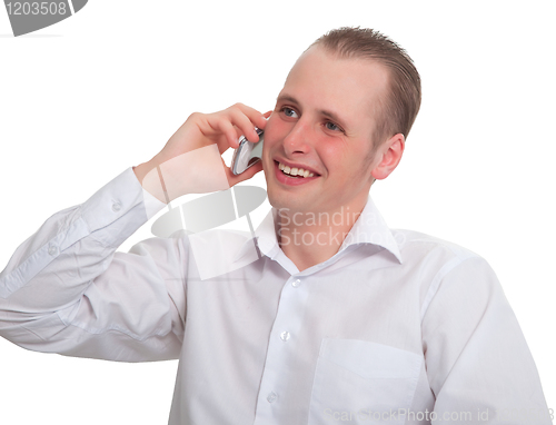 Image of The young man says with a smile on your mobile phone