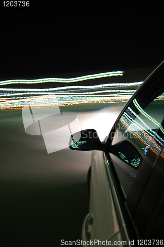 Image of night drive with car in motion 