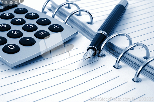 Image of business organizer and pen