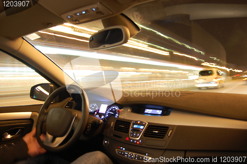 Image of car in motion at night