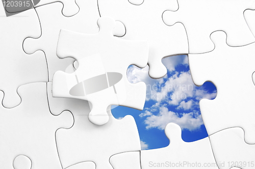 Image of puzzle and sky